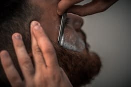 man is shaving