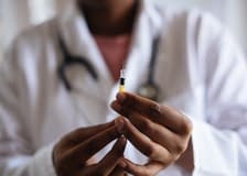 man holding injection