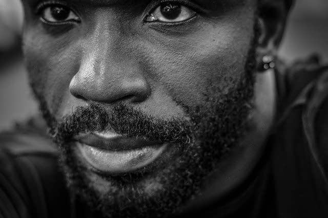 a close image of a man with thick beard