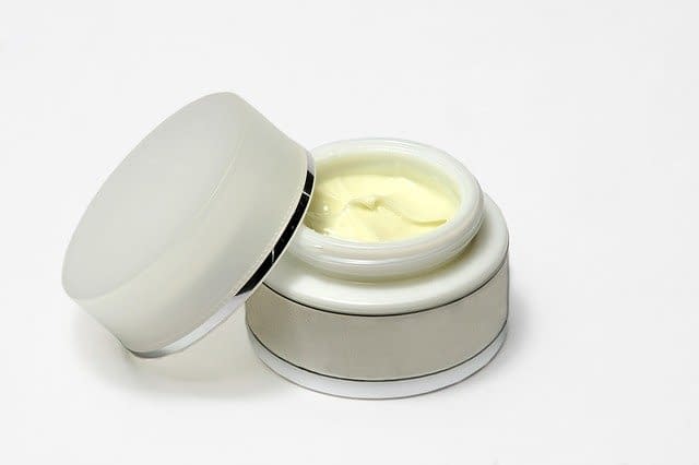 An open box of cream lying on a table